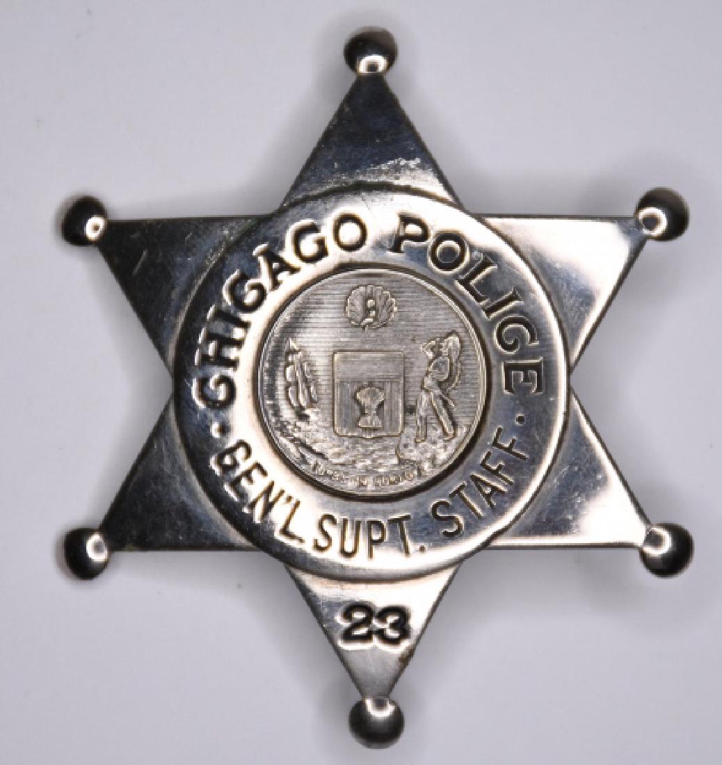 Chicago Police General Supt. Staff Badge #23: Nice obsolete 6 point star Chicago Illinois Police General Superintendent Staff Badge #23. The badge is in nice condition with the pinback. Measures approx. 2-1/2" tall x 2-1/4" across. Made by C.H. H