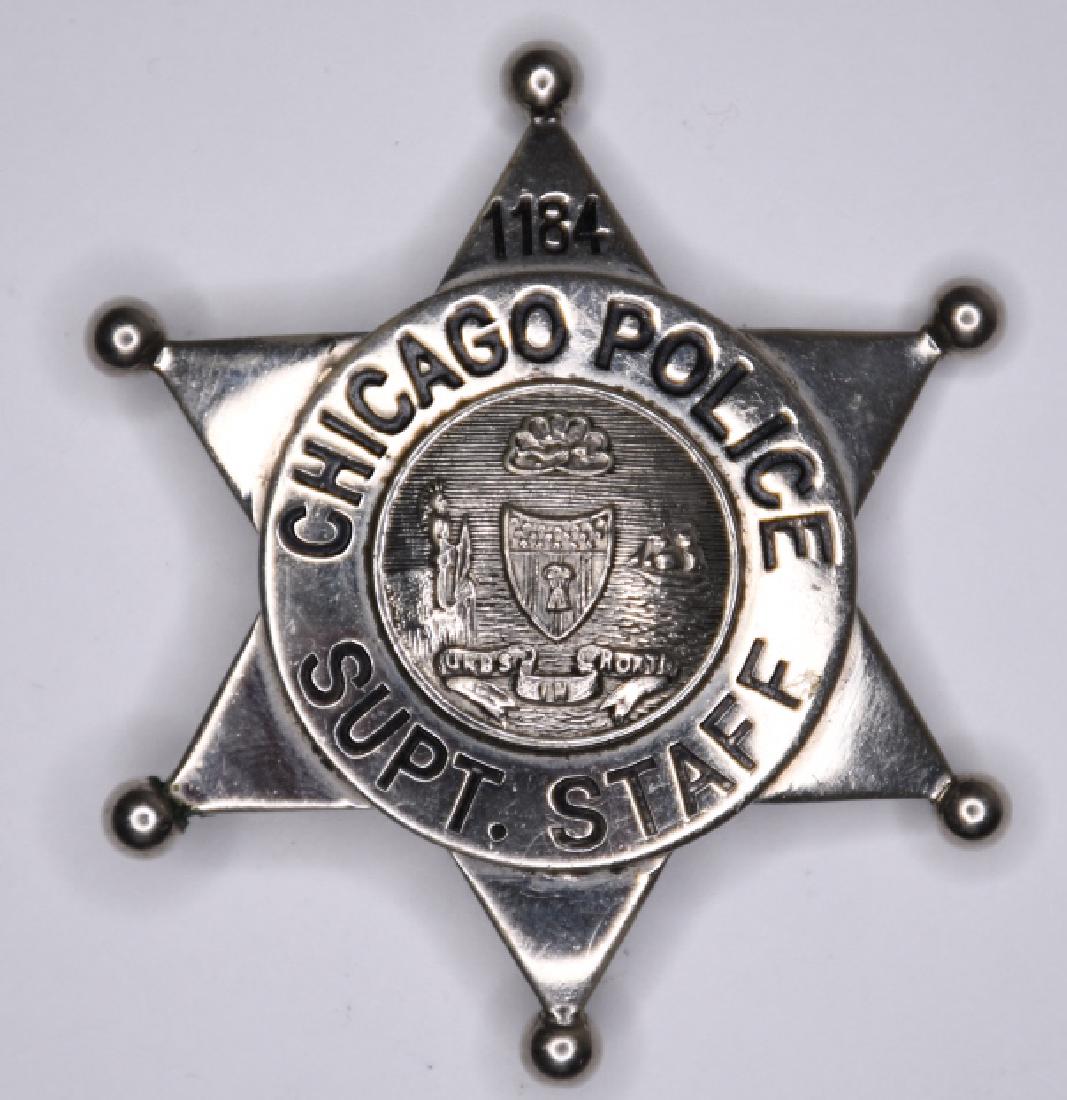Chicago Police Superintendent Staff Badge #1184: Nice obsolete 6 point star Chicago Illinois Police Superintendent Staff Badge #1184. The badge is in nice condition with the pinback. Measures approx. 2-5/8" tall x 2-5/8" across. Made by S.D. Childs