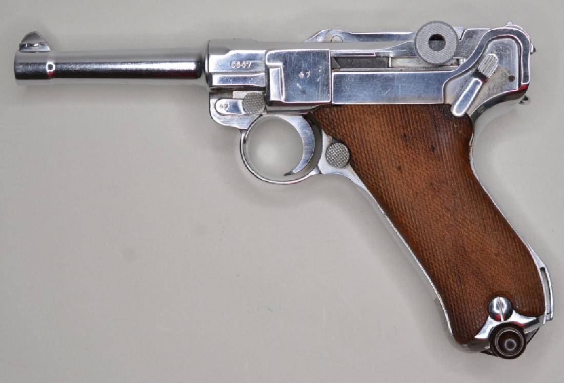 WWII 1937 Mauser 9mm Luger Semi-Auto Pistol: Nice WWII Mauser 1937 German Luger P08 Semi-Automatic Pistol in 9mm. The pistol is in nice condition with a nickel finish. The Luger has the 1937 chamber mark and Mauser military proof marks on the re