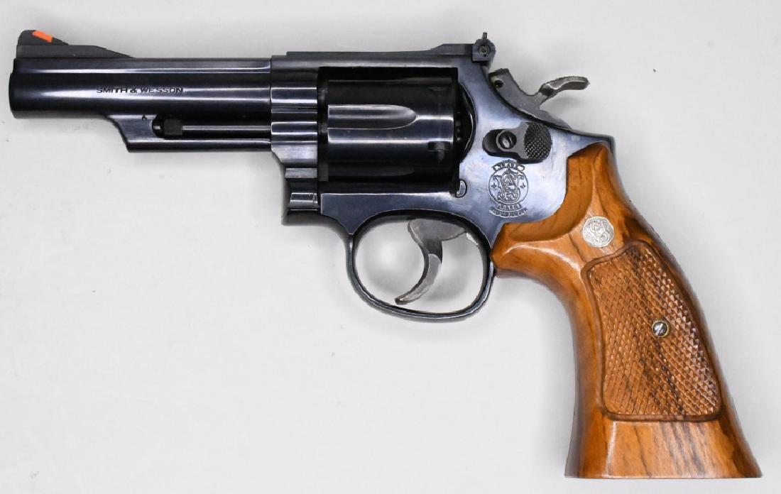 Smith & Wesson #19-5 .357 Combat Magnum Revolver: Very nice Smith & Wesson Model 19-5 .357 Combat Magnum six-shot revolver with a 4-1/8" barrel. The blue finish revolver is in great condition in the original S&W box with the paperwork. SN:AUJ1250. FF