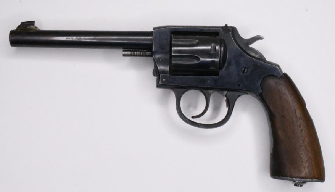 I.J.A. & C. Co. I.J. Target .22 Cal. Revolver: I.J.A. & Company Model I.J. Target eight-shot revolver in .22 caliber. The blue finish pistol has a 5" barrel and is in good used condition with finish wear and wood grips. SN:M57357. FFL required for