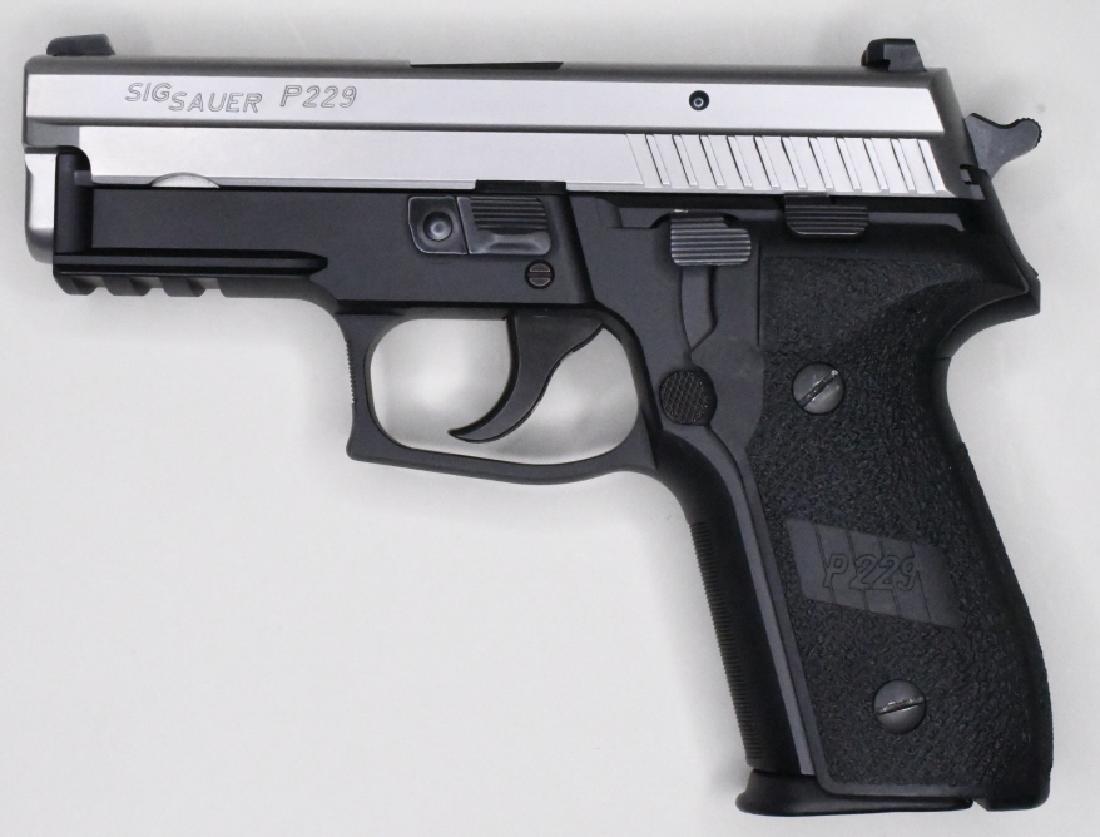 Sig Sauer P229 9mm Pistol New In Box: New in box Sig Sauer Model P229 semi-automatic pistol in 9mm. The satin stainless and black pistol has a 3.9" barrel and is in great new condition in the original hard case with lock, two magazines, a