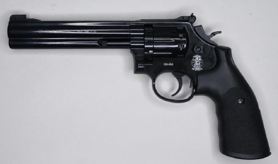 S&W Model 586 .177/4.5mm Pellet CO2 Pistol NIB: New in box German made Smith & Wesson Model 586 CO2 Pistol in .177/4.5mm Pellet. The pistol has a 6" barrel and is in mint condition in the original hard case with instructions, pellets, and CO2 cylin