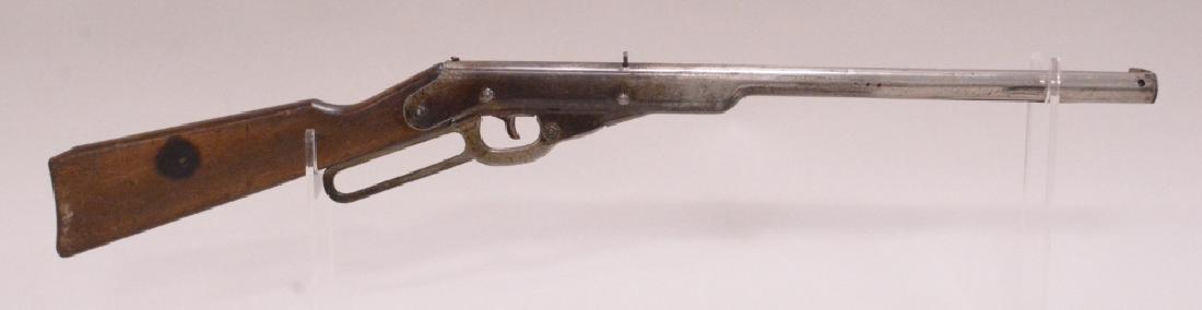 Daisy No.102 Mod. 33 Lever Action BB Rifle: Nice vintage Daisy no.102 model 33 lever action, 500 shot bb rifle with wood stock. Nice condition with plate loss and wear from use and age.