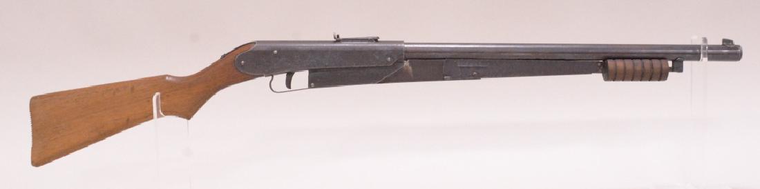 Vintage Daisy Model 25 Pump Action BB Gun: Vintage Daisy variant 7 model 25 pump action bb gun with 6 groove forearm, wood stock, and etched receiver. Nice condition with age appropriate wear.