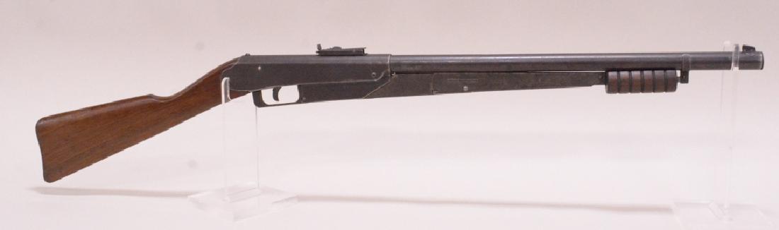 Vintage Daisy Model 25 Pump Action BB Rifle: Vintage Daisy variant 4 model 25 pump action bb gun with 5 groove forearm, and straight pistol grip walnut stock. Nice condition with age appropriate wear.