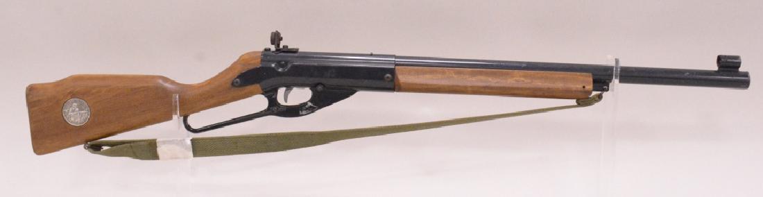 Daisy Model No. 99 Lever Action BB Rifle: Nice Daisy model no. 99 official shooting education lever action bb rifle with wood stock and strap. Nice conditon with wear from use and age.