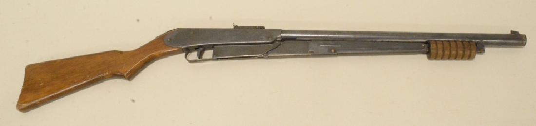 Vintage Daisy Model 25 Pump Action BB Gun: Vintage Daisy model 25 pump action bb gun with 6 groove forearm, wood stock, and etched receiver. Nice condition with light surface rust and wear from use and age.