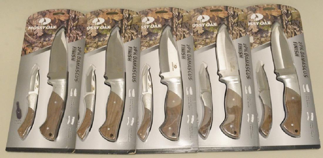 Lot Of 5 Mossy Oak Knife Sets With Sheath: Nice lot of 5 Mossy Oak #3613 knife sets. Sets includes two stainless steel fixed blade knives with damascus finished handles. Largest knife measures approximately 10 1/2" long.