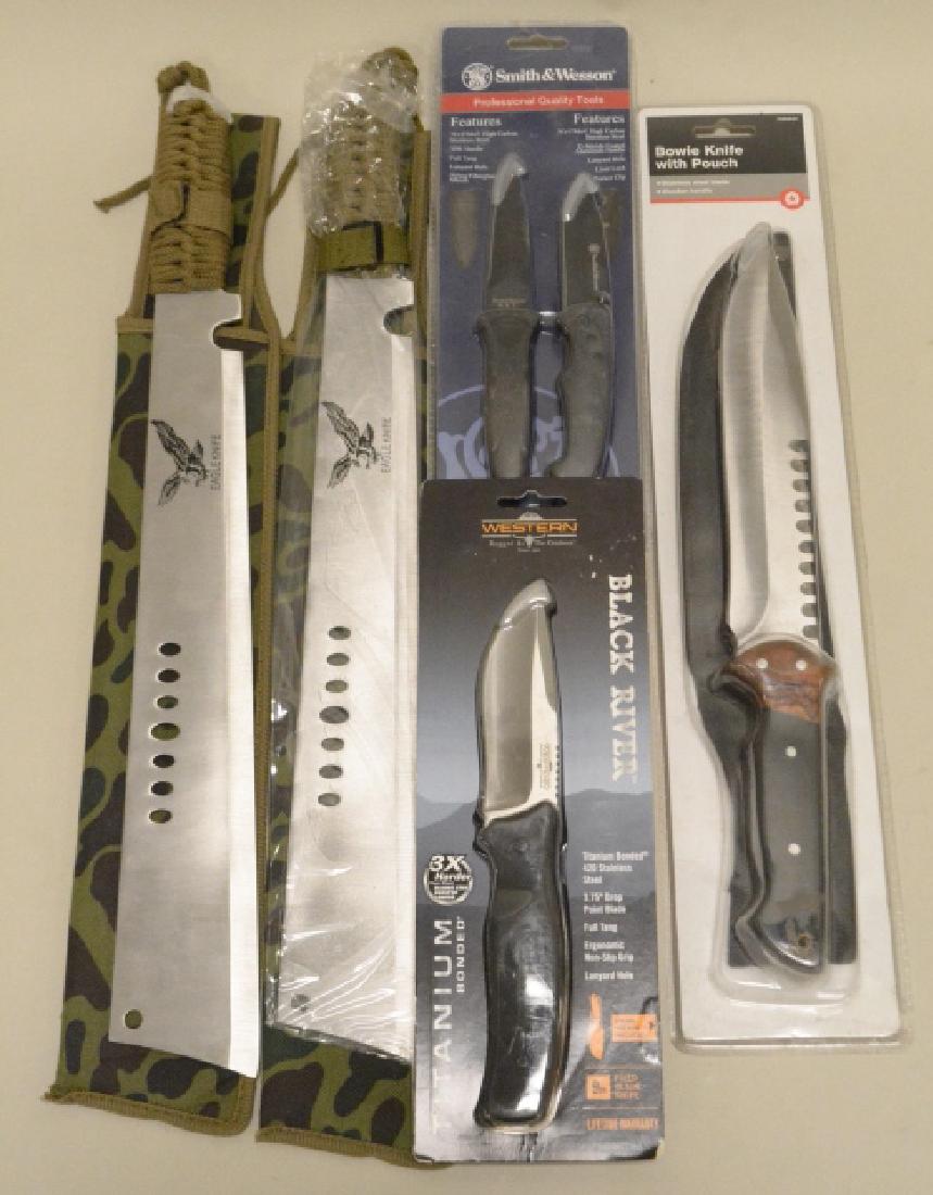 Lot Of 5 Brand New Hunting Knives: Nice lot of 5 brand new knives. Lot includes a TSC Bowie Knife with pouch, a Smith & Wesson two knife set, a Western Black River 9" fixed blade knife, and two Eagle Knife machetes. All five are brand