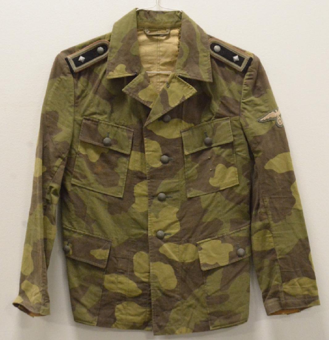 Museum Repro WWII German Waffen SS Camo Tunic: Museum quality reproduction WWII German Waffen SS Italian Theatre camouflage pattern 4-pocket tunic. Comes with Panzer SS EM boards and early SS sleeve eagle. Size Small.