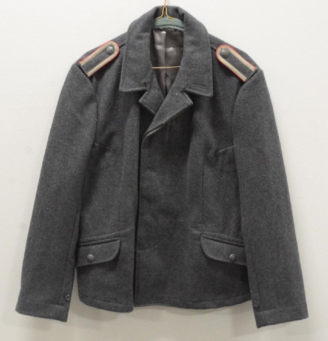 Museum Repro WWII German Luftwaffe M-40 Tunic: Museum quality reproduction WWII German Luftwaffe M-40 Flieger tunic. Comes with Flak NCO slip on boards and artificial silk lining. Size 40R.