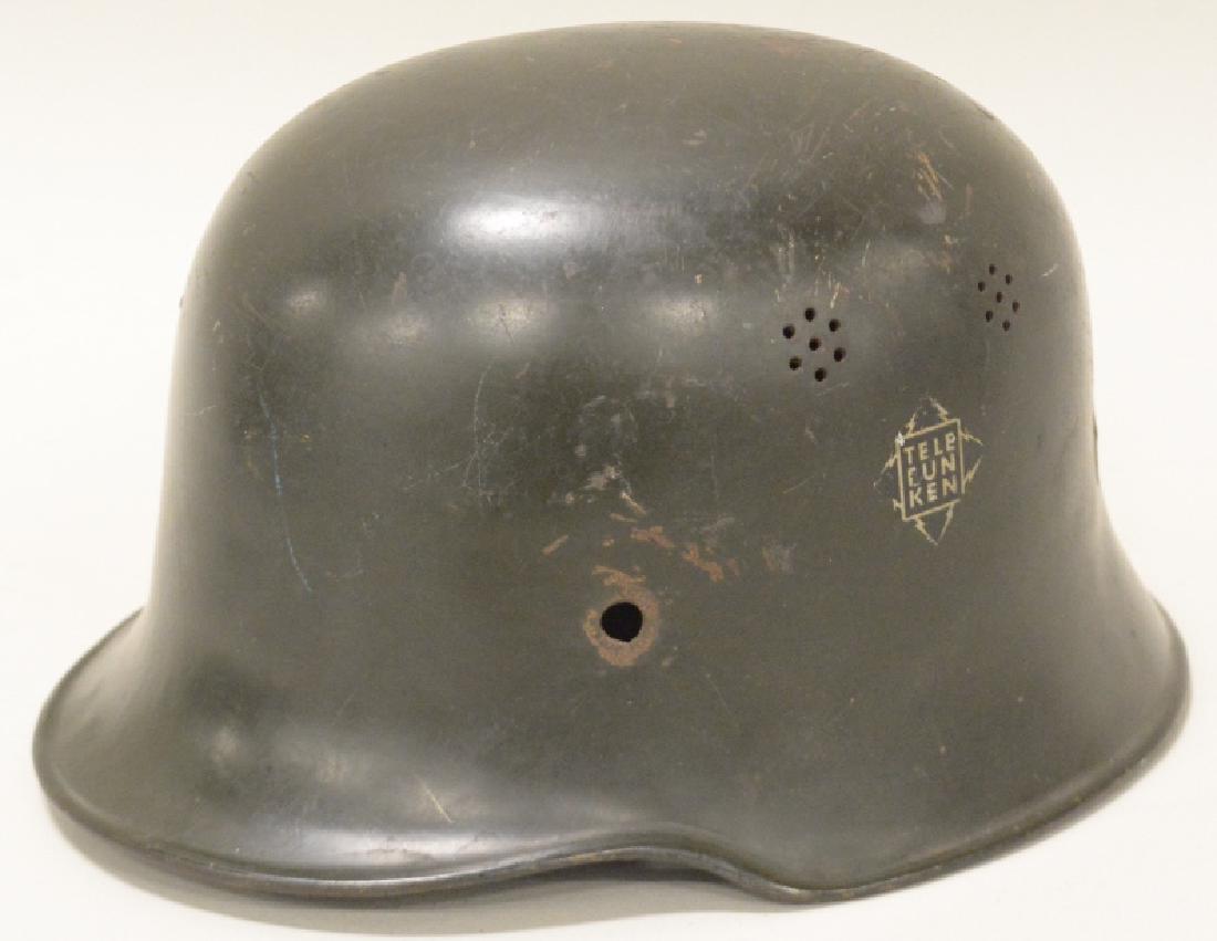 WWII German Fire/Police Telefunken Co. Helmet: Original WWII German Fire/Police Telefunken Company double decal, "salt and pepper" vent. Nice original condition with paint loss, and decal wear from use and age. Displays very well with with Telefun