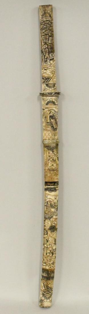 Vintage Carved Bone Samurai Sword: Nice vintage hand carved bone Japanes Samurai sword with carved bone scabbard. Nice condition with some cracks in the handle and scabbard. Displays extremely well with hand carved Japanese scenes in h