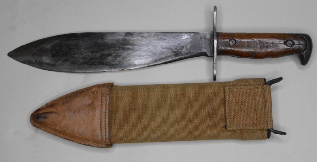 WWI Plumb Model 1917 Bolo Knife With Sheath: Nice WWI Plumb Model 1917 Bolo Knife with sheath. Knife is in good used condition with the original sheath and was made in 1918. Blade measures approximately 10.25" long, overall length 16".