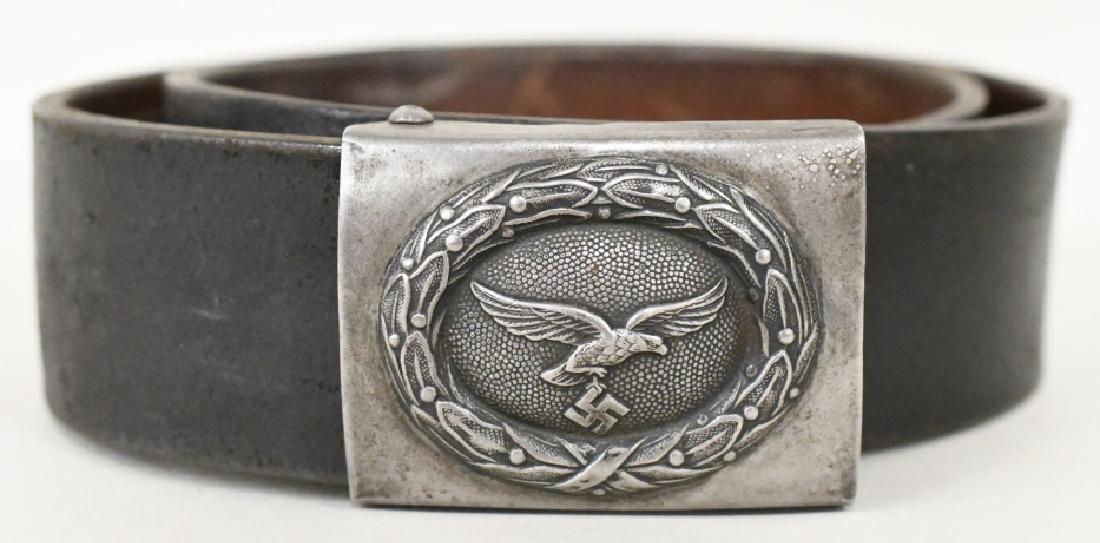 WWII German Luftwaffe Belt Buckle: Nice condition with wear to leather strap and buckle. No markings. Buckle measures approximately 2 1/2" across by 2" tall. Belt measures approximately 36 1/2" across.