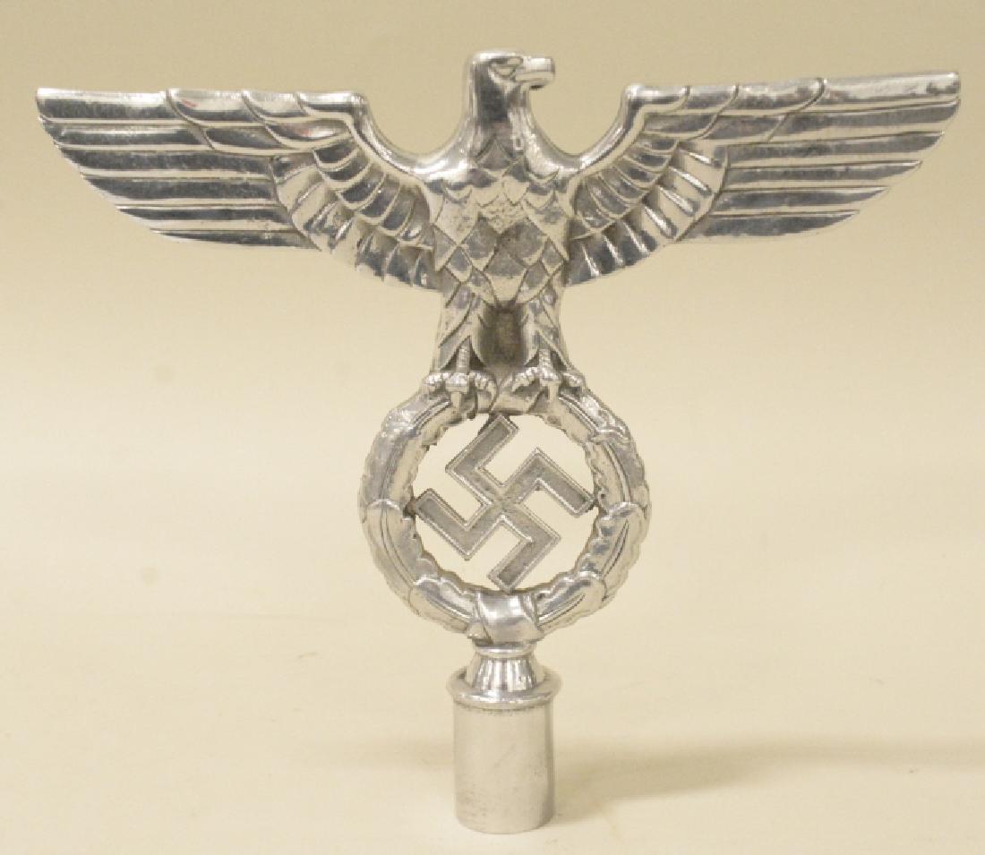 WWII German Flag Pole Topper: Nice WWII German flag pole topper. Nice condition with pitting and wear. Measures approximately 8 1/2" tall by 9 1/2" across. REF#63
