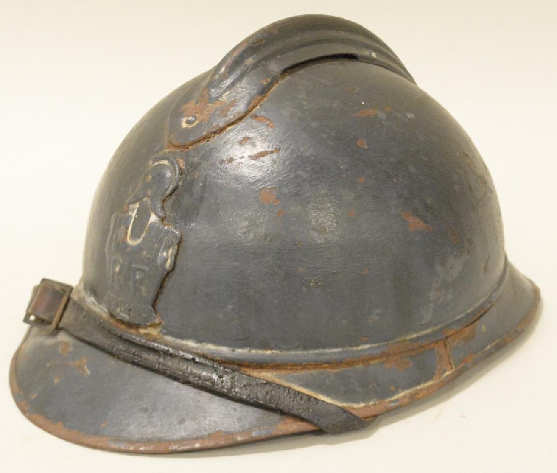 WWI French Army Adrian Engineers Combat Helmet: Nice WWI French Army Engineers Arian 3 piece combat helmet with original liner and chinstrap. Displays very well with engineers front plate. Helmet is in nice condition with wear to liner.