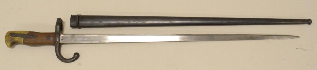 Model 1874 French Gras Bayonet w/ Scabbard: Nice model 1874 French Gras bayonet with numbers matching scabbard and script on blade edge. Nice condition with age appropriate wear. Edge of blade is dated 1877. Blade meaures approximately 20 1/2" 
