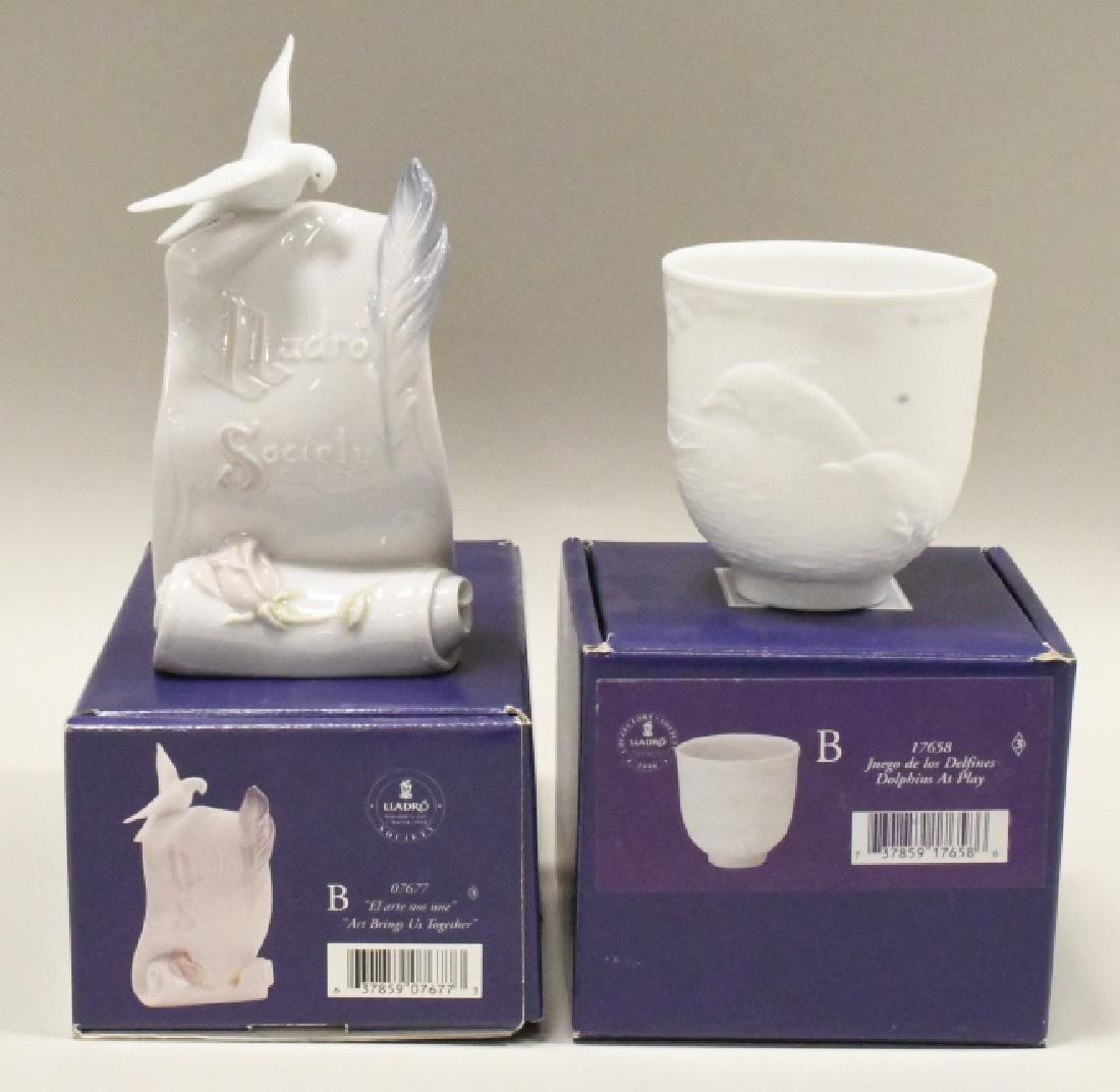 Lladro Collector's Society Scroll & Cup MIB: Lot includes 1998 "Dolphins At Play" Cup/Votive #17658 & 1999 "Art Brings Us Together" society scroll #7677. Both retired.