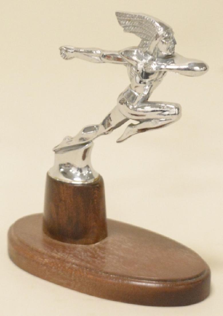1936 Pontiac Running Chief Hood Ornament: Mounted to custom made base. Chrome has very good shine. Light wear. Measures 5.5" x6".