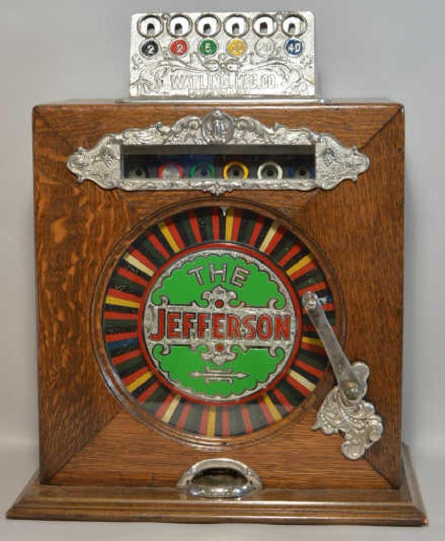 Watling 5 Cent The Jefferson Counter Wheel Slot: Nice vintage table top Watling MFG The Jefferson counter wheel 5 cent slot machine . Very nice working condition with some cosmetic wear from use and age. Measures approximately 20" tall by 16" across