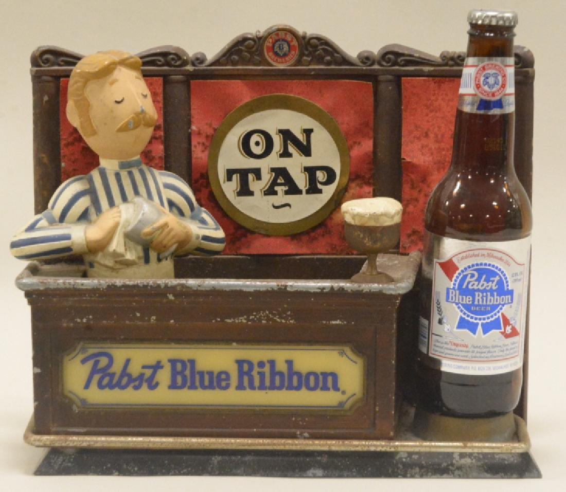 Pabst Blue Ribbon Beer on Tap Advertising Display: Light up display with bartender and bottle. Plastic and cast metal. Heavy. Paint wear and some paper damage to the back.