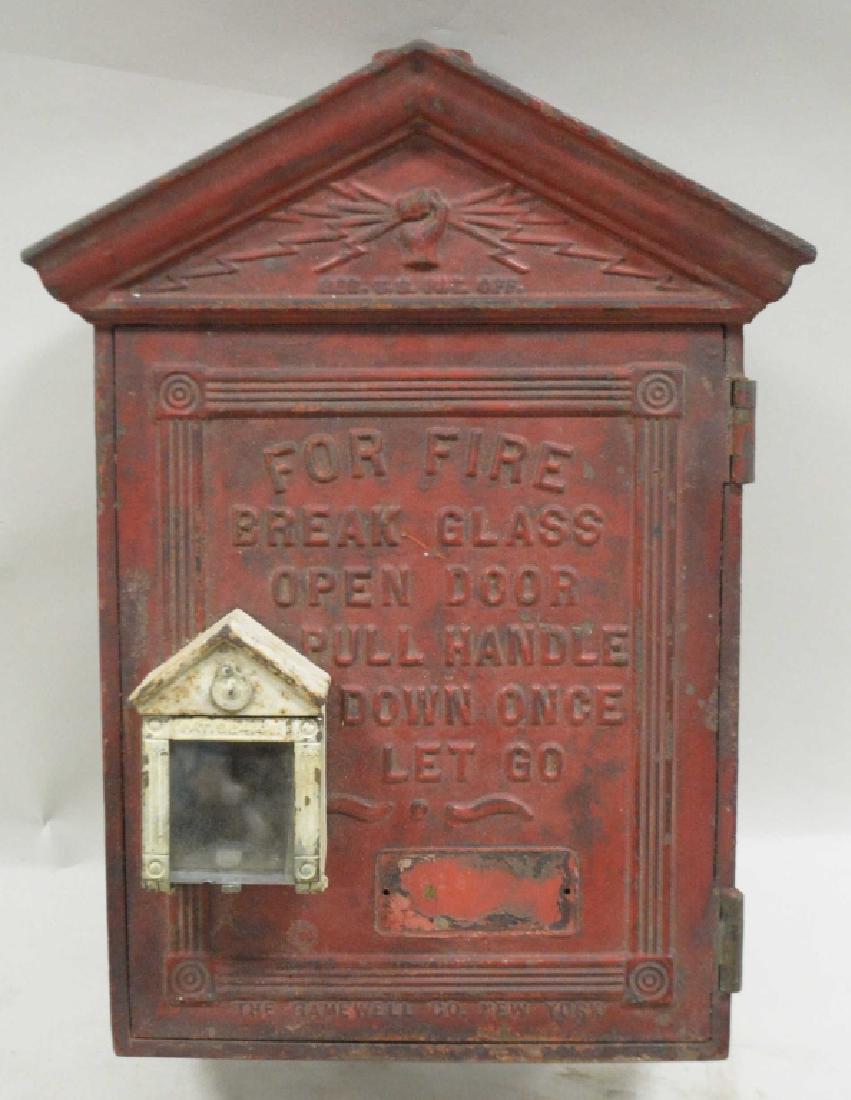 Fire Alarm Emergency Street Box: Cast iron, glass window for emergency handle, paint wear and loss.