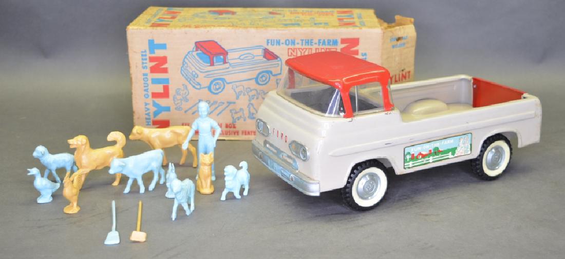 Original Ny-Lint No.7100 Fun-On-The-Farm Truck: Original Ny-Lint No.7100 Fun-On-The-Farm pick-up truck in the box. Comes with two garden tools, ten farm animals, and one boy. Truck is in nice condition with light wear, box has some stains and tatte