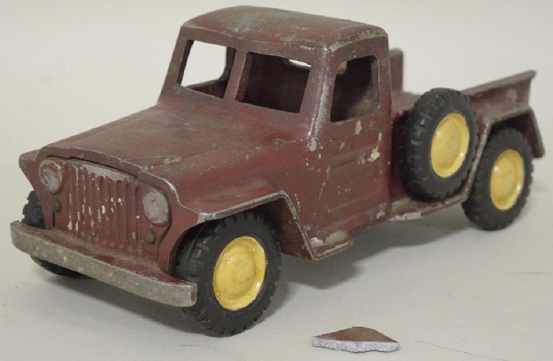 Al-Toy Die Cast Aluminum Willy's Jeep Truck: Al-Toy die cast aluminum Willy's Jeep truck. Nice condition with paint loss and wear. Does have some damage to the rear passanger side fender. All tires have "Al-Toy" marked on them. Displays very wel