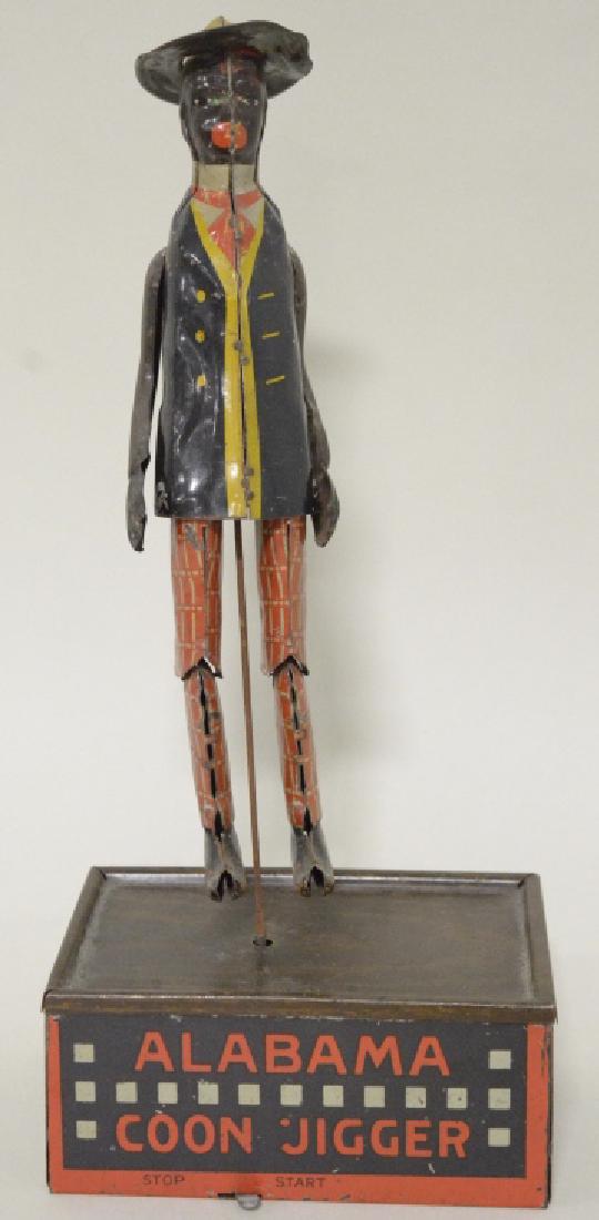 Tombo Wind Up Alabama Coon Jigger: Nice vintage Tombo wind up tin litho Alabama Coon Jigger. Very nice condition with light paint loss and wear from play and age. Windup needs work. Measures approximately 10.5" tall.