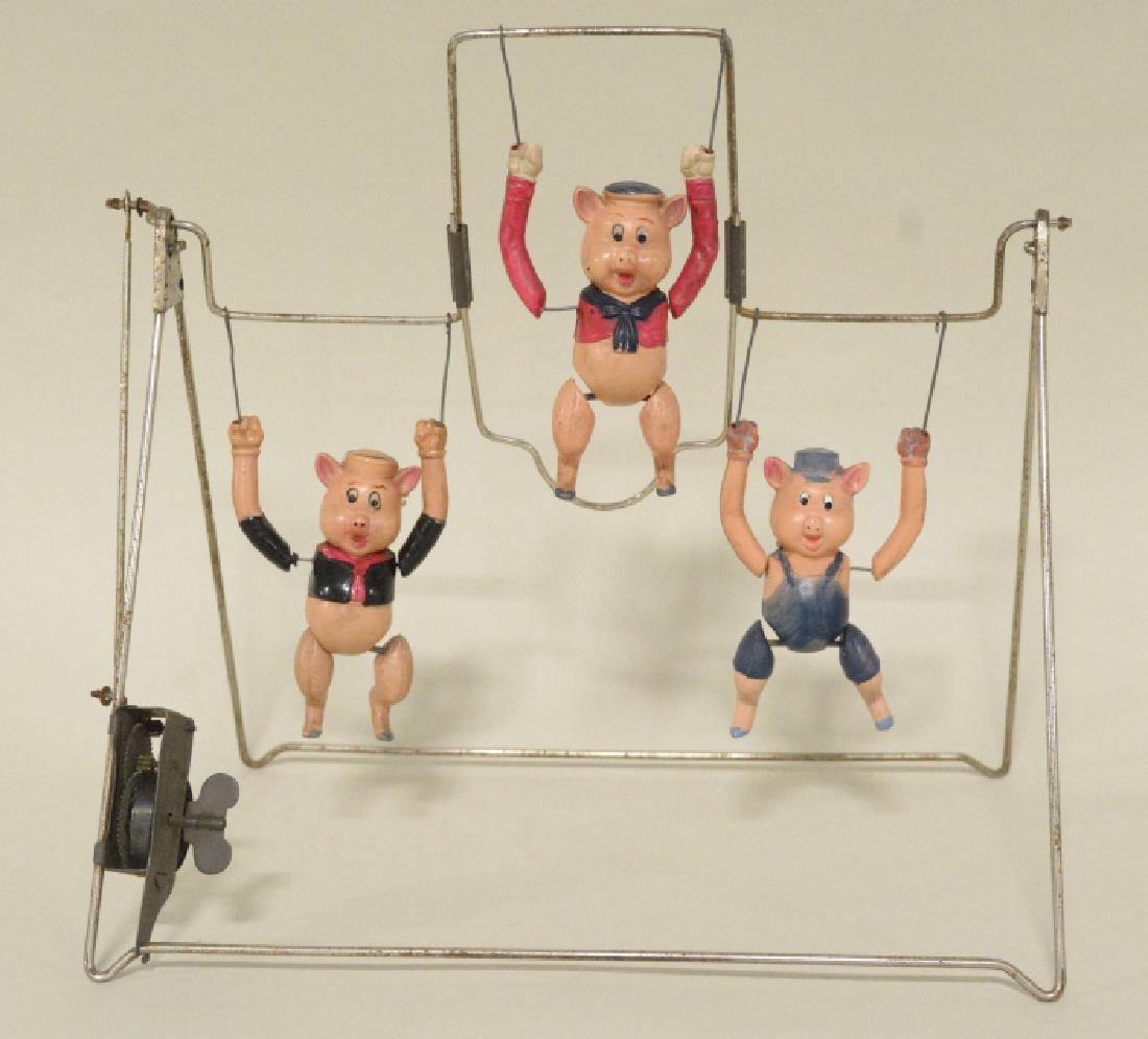 T Toys Celluloid Walt Disney's Three Pigs Trapeze: Nice vintage Japan K Toys celluloid Walt Disney's Three Pigs Trapeze. Nice condition with some wear from play and age. Wind up works great. Measures approximately 11" across.