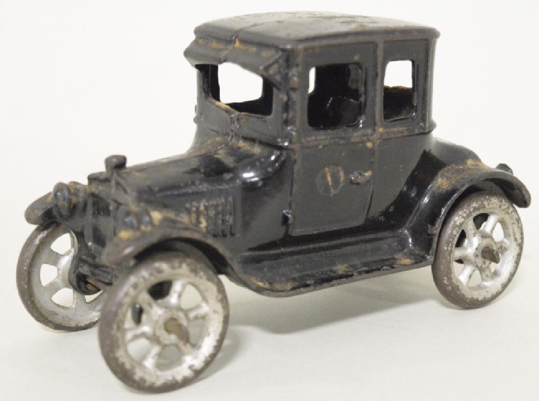 Cast Iron Ford Model T Coupe: Nice cast iron Ford Model T coupe. Nice condition with paint loss and wear. Measures approximately 6" long.