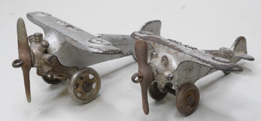 Two Cast Iron Hubley/Arcade? Miltary Airplanes: Mixed lot of two cast iron Hubley or Arcade Miltary airplanes. Marked UX 33 and UX 99. Both in nice condition with paint loss, and surface rust. Overall they display nice. Largest wingspan measures ap