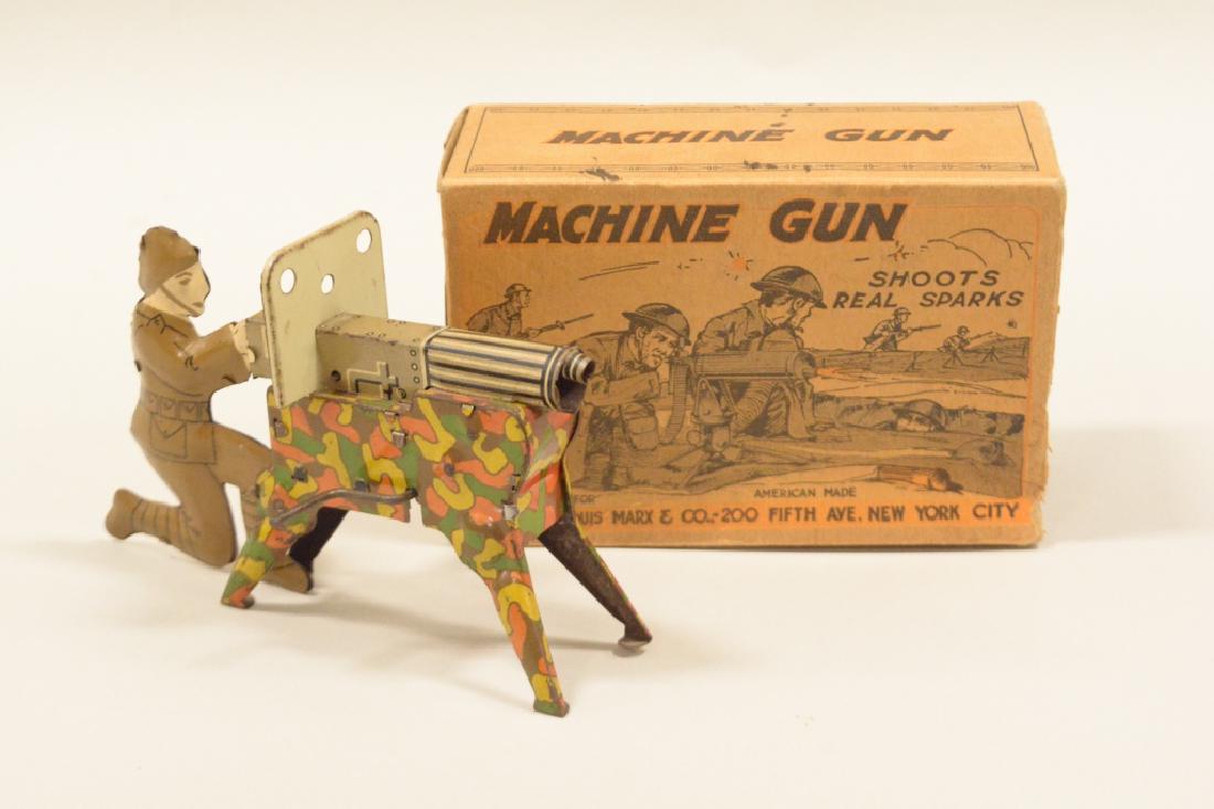 Vintage Tin Litho Marx Sparking Machine Gun In Box: Very nice marx tin litho sparking machine gun in box. Very nice condition with light wear from use and age. Box does have some flap damage. Displays well with great colors and graphics. Measures appro