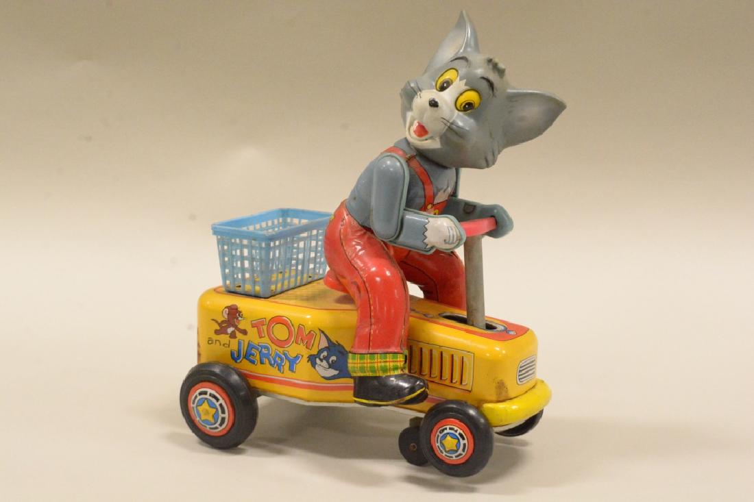 Modern Toys Japan Tom And Jerry Battery Op Handcar: Very nice vintage Modern Toys Japan Tom and Jerrry tin litho battery operated "Tom" handcar. Nicecondition with wear from use and age. Has a replacement back wheel. Battery compartment is clean but un