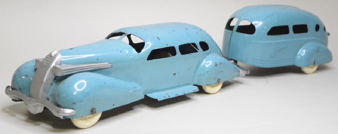 Wyandotte Lasalle And Travel Trailer: Nice baby blue Wyandotte Lasalle and Travel Trailer. In nice condition with paint loss, and surface rust. Has replacement tires. Has a crack in the front driver fender. Measures approximately 25.5" lo