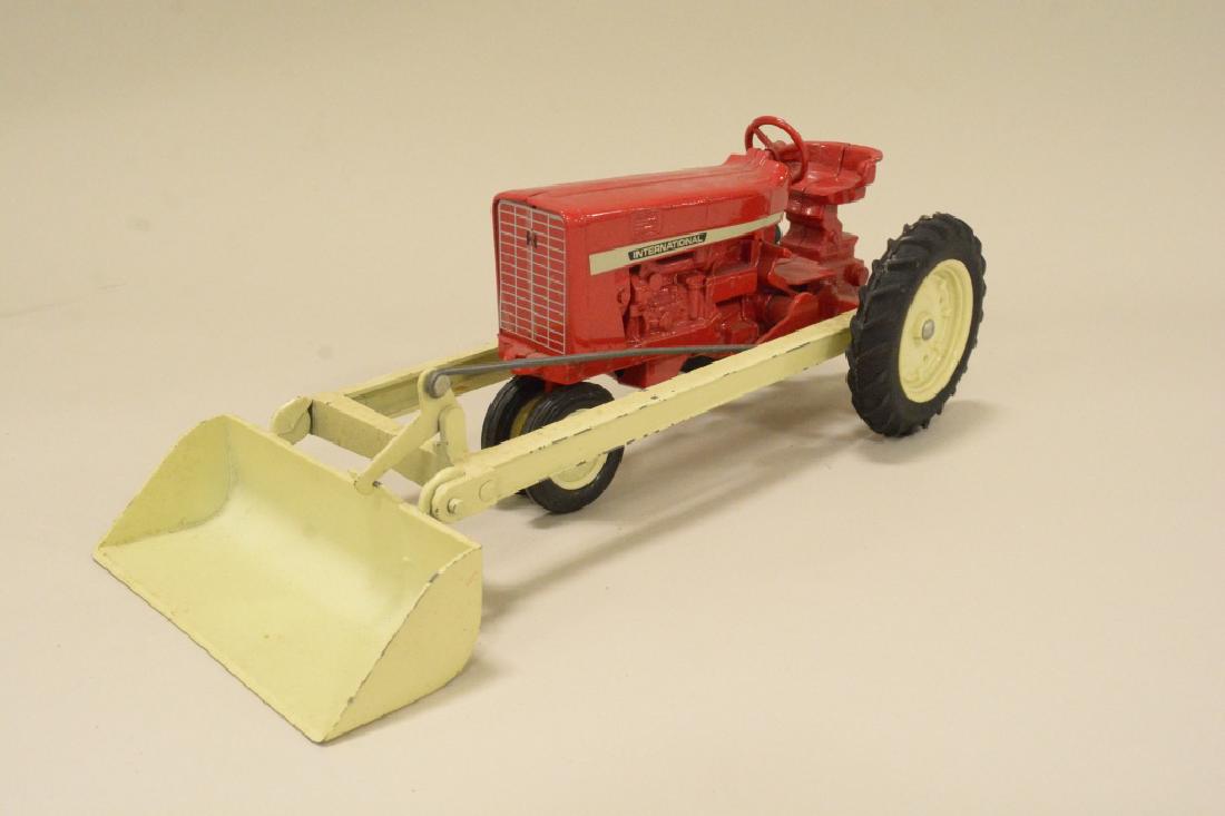 1/16 Scale Ertl IH Tractor With Loader: Nice 1/16 scale die cast Ertl IH NF tractor with loader. Nice condition with light wear from display.
