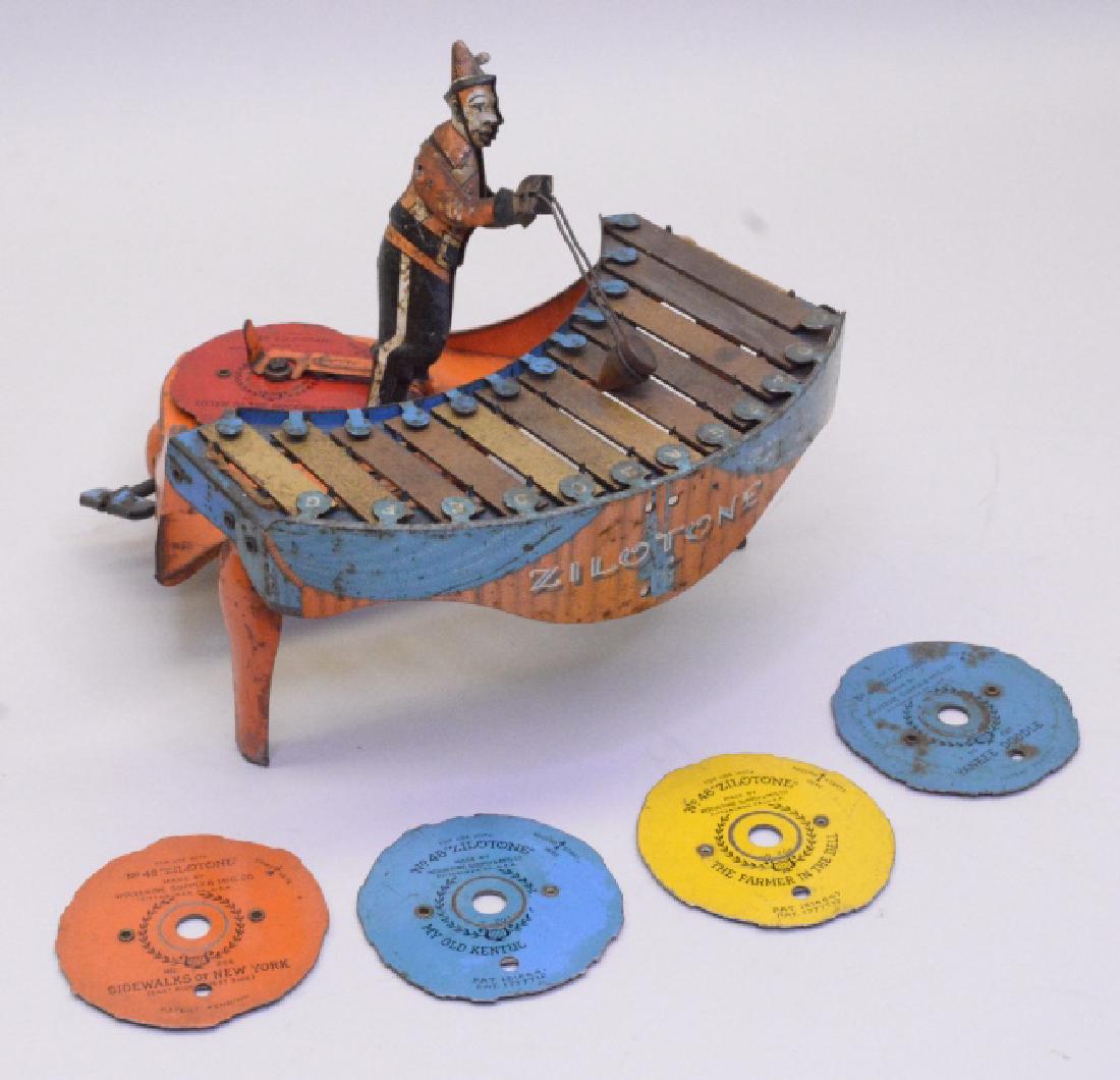 Wolverine Toy Wind Up Zilotone No.48.: Original Wolverine Toy Wind Up Zilotone No.48 with reproduced box. Has paint wear and surface rust. Comes with key and five disc tunes. Wind up is not working.