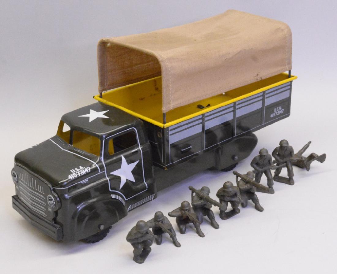 Marx Tin Litho Army Truck: Very nice Marx Tin litho Army truck with canvas top and nine army guys. In nice condition with a small hole on the canvas top. Displays very well with great color and graphics. Measures approximately