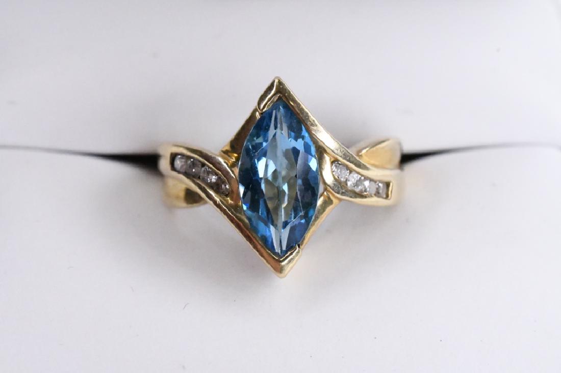 Ladies 10K Yellow Gold Blue Topaz Diamond Ring: Genuine blue topaz and diamonds. Size 7, 4.3 grams total weight.