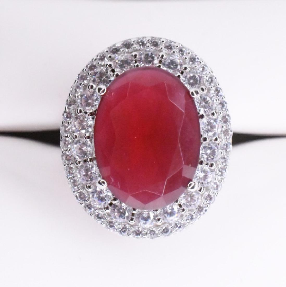6.55 Ruby Sterling Dinner Ring: Marked .925, lab created stones, size 6.75