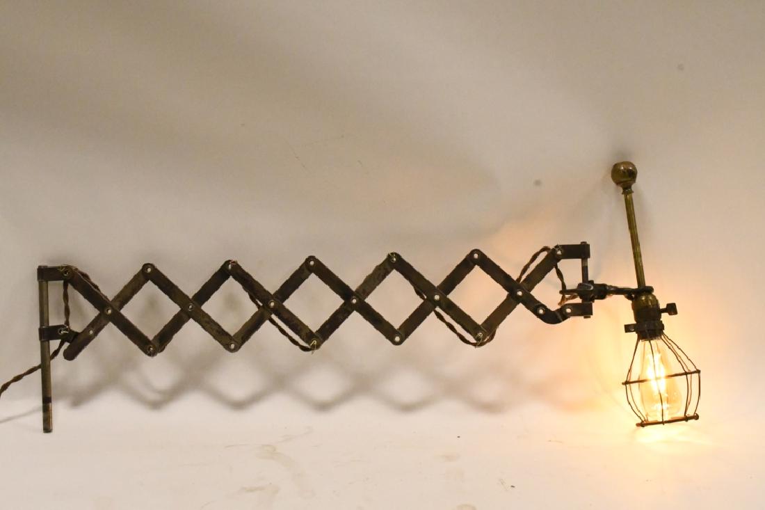 Industrial Accordian Style Light: Nice industrial accordian style light. Displays well with a great industrial look. Includes edison bulb. Measures approximately 34" across when full extended.