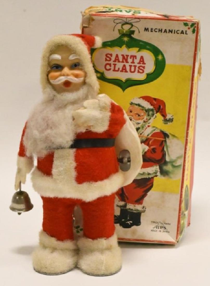 Vintage ALPS Japana Wind Up Mechanicle Santa Claus: Very nice vintage ALPS Japan tin wind up Mechanicle Santa Claus in original. box. Very nice cosmetic condition with light wear from play and age. Works very well. Measures approximately 9 1/2" tall.