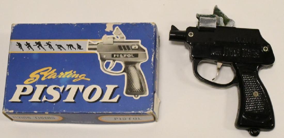 Bur Lee Flying Tigers Starting Pistol Cap Gun: Scarce vintage Bur Lee Flying Tigers starting pistol cap gun in box. Very nice condition in original box. Does appear to have been repaired on the silver cast metal platform which the caps are hit on.