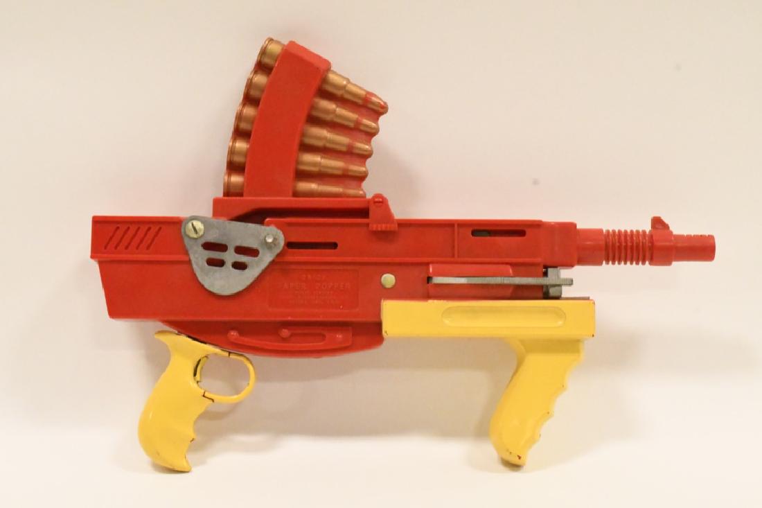 Vintage Daisy Paper Popper Gun: Nice condition vintage Daisy Paper Popper Gun. The pistol shows little play wear. Gun measures 13" long overall.
