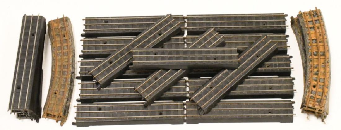Pre War Lionel OO Three Rail Track Lot: Nice lot of 24 pre war Lionel OO three rail track pieces. Lot includes 18 straight pieces of track. One of the 18 pieces is damaged. Track is in good condition but will need to be cleaned. Also includ