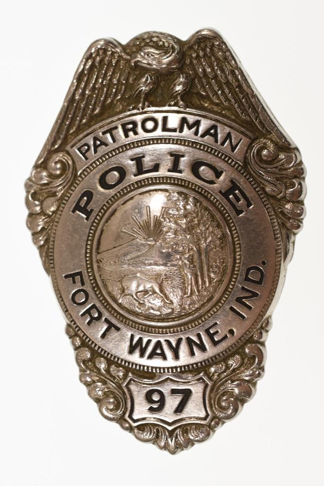 Obsolete Fort Wayne Indiana Patrolman Badge #97: Nice obsolete Fort Wayne Indiana Patrolman Police Badge #97. Badge is in nice condition with pinback. Back is unmarked. It measures approximately 3" in tall by 2" across.