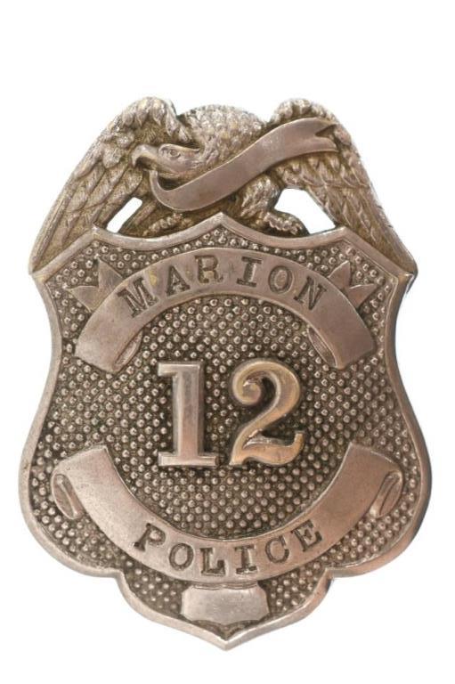 Obsolete Marion Indiana Police Badge #12: Nice obsolete Marion Indiana Police Badge #12. Badge is in nice condition with pinback. Back is unmarked. It measures approximately 2-1/2" tall by 1-3/4" across.