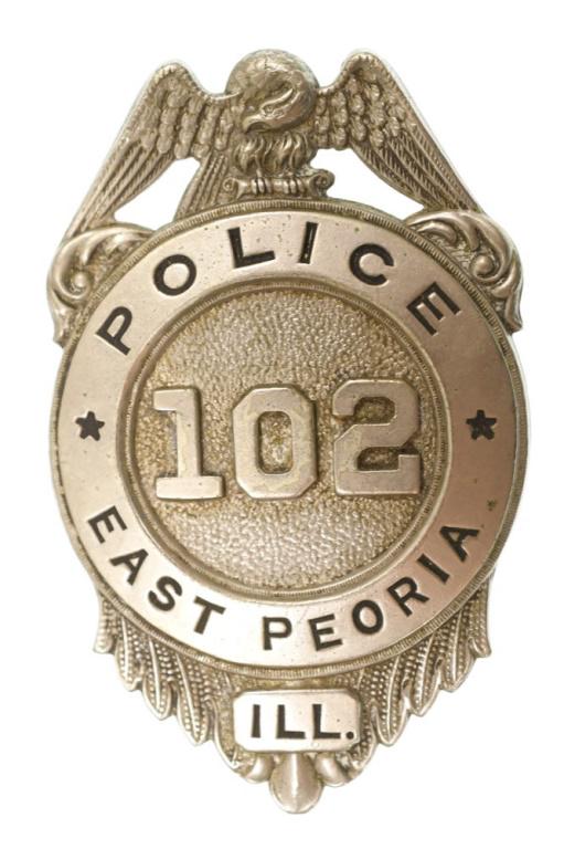 Obsolete East Peoria Illinois Police Badge: Nice obsolete East Peoria Illinois Police Badge. Badge is in nice condition with wear from use and age. Has pinback. Back is unmarked. Measures approximately 2-3/4" tall by 1-3/4" across.